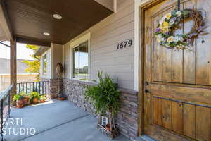 Property entrance with covered porch