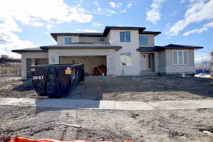 View of front of house with a garage