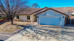 Single story home featuring a garage