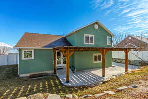 Rear view of house with a patio