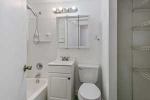 Full bathroom with vanity, toilet, and shower / bathing tub combination