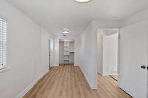 Hallway featuring light hardwood / wood-style floors