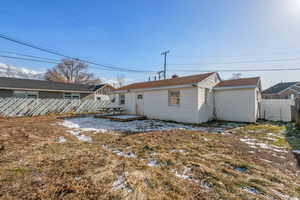 Rear view of property with a deck