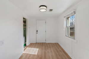 Foyer with light wood-type flooring