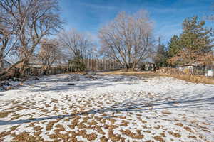 View of yard covered in snow