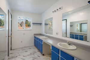 Bathroom with dual vanities