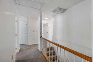 Hallway with carpet floors