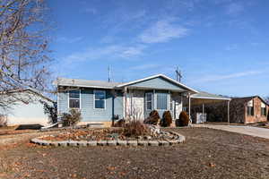 Ranch-style home with a carport