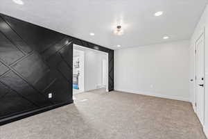 Unfurnished room featuring light colored carpet