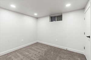 Basement featuring carpet flooring