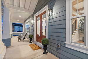 Doorway to property featuring a porch