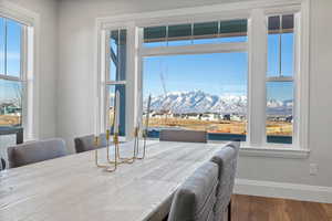 Dining space featuring hardwood / wood-style flooring and a mountain view