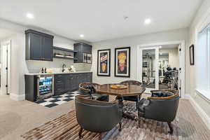 Interior space with indoor wet bar and beverage cooler