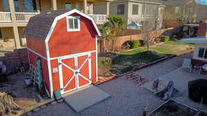 View of outbuilding with a lawn