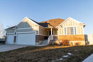 View of front of property with front lawn and garage