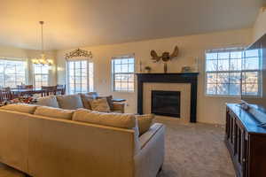 Carpeted living room with fireplace