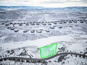 Snowy aerial view featuring a mountain view