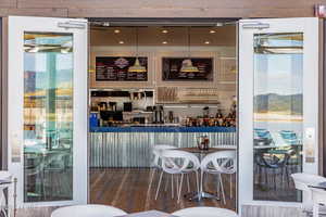 Bar featuring a wealth of natural light