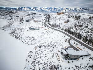 Snowy aerial view featuring a mountain view