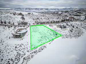 Snowy aerial view with a mountain view