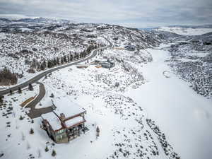 Snowy aerial view featuring a mountain view