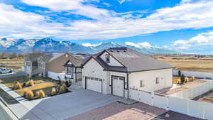 View of front of home featuring a garage and a mountain view