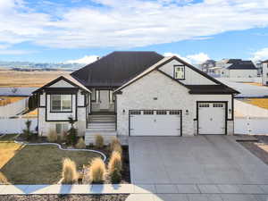 View of front of property with a garage