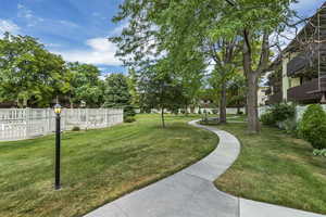 View of community featuring a lawn