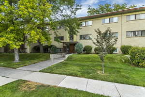 View of community featuring a lawn