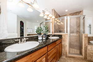 Bathroom with an enclosed shower and vanity