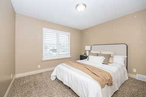 View of carpeted bedroom