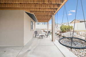 View of patio featuring a fire pit