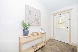 Foyer with vaulted ceiling