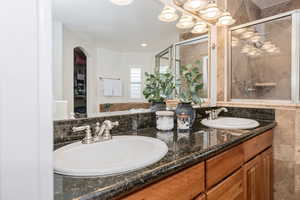 Bathroom with vanity and walk in shower