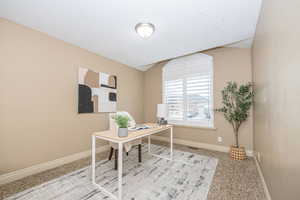 View of carpeted home office