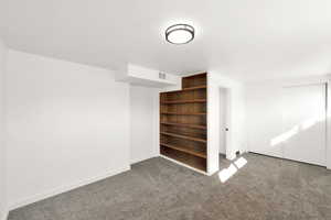 Unfurnished bedroom with a closet and carpet