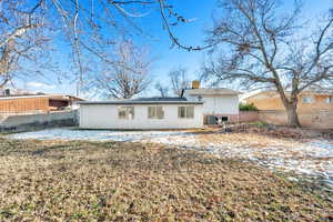 Rear view of property with central AC unit