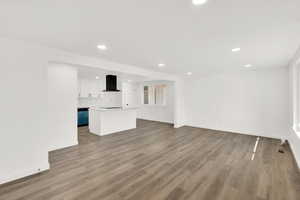 Unfurnished living room featuring light hardwood / wood-style floors