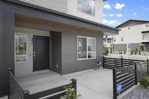 Doorway to property with covered porch