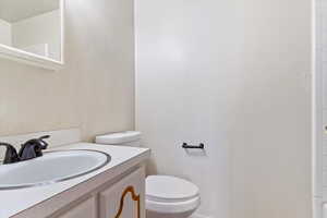 Bathroom with vanity and toilet