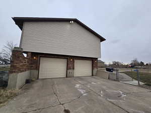 View of side of property featuring a garage