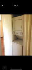 Laundry room featuring stacked washer and dryer