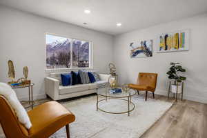 Living room with hardwood / wood-style floors