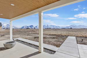 View of patio / terrace featuring a rural view and a mountain view