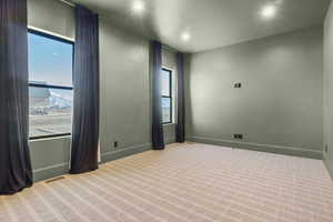 View of carpeted spare room