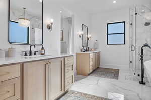 Bathroom featuring vanity and walk in shower