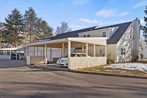 View of front facade with a carport