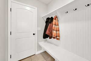 Mudroom featuring light tile patterned floors