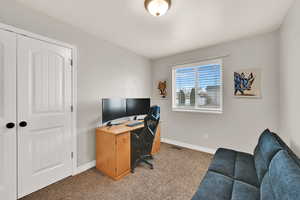 View of carpeted home office