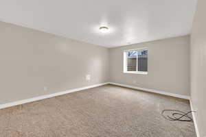 View of carpeted spare room